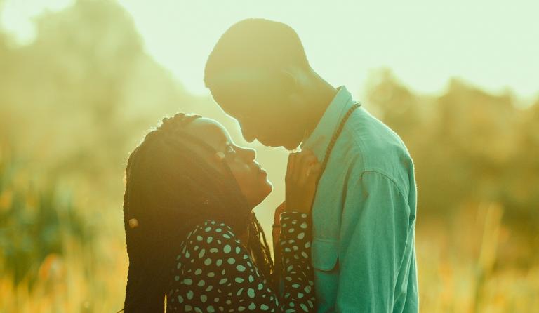 Black couple in a field