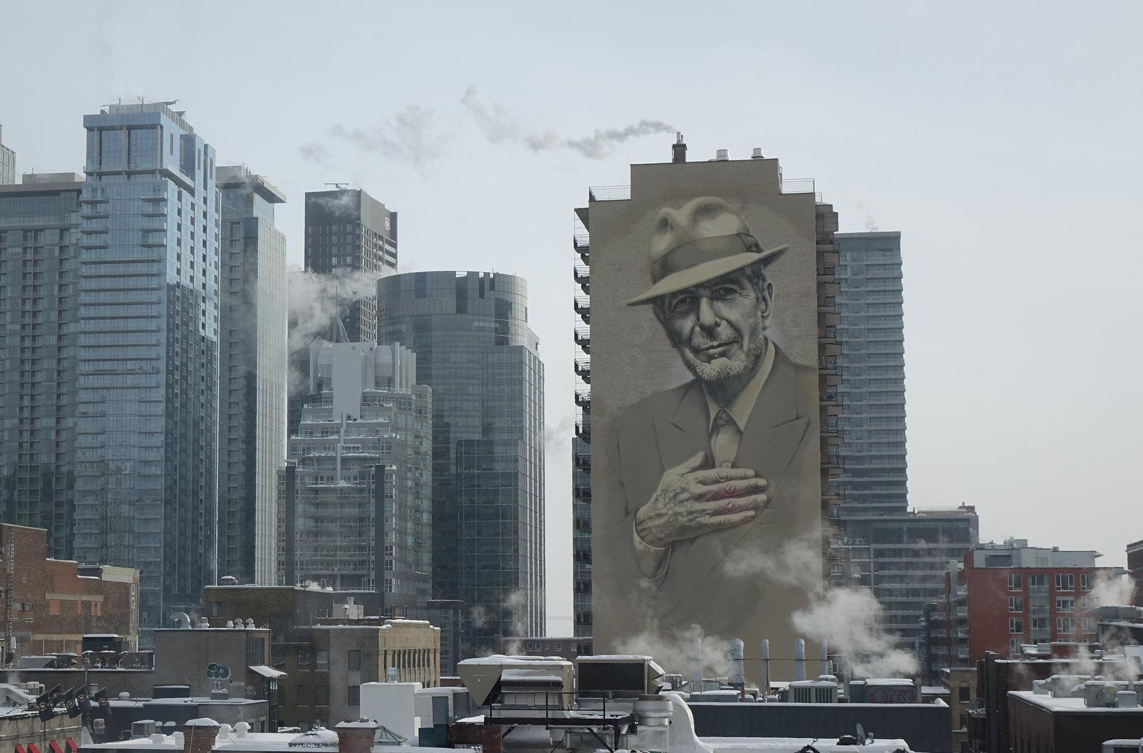 Montreal cityscape with huge Leonard Cohen mural