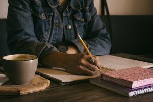 Woman writing in a notebook