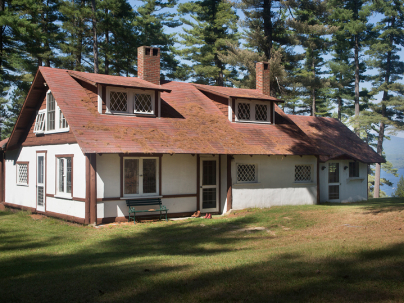 A cute cabin with diamond-paned windows