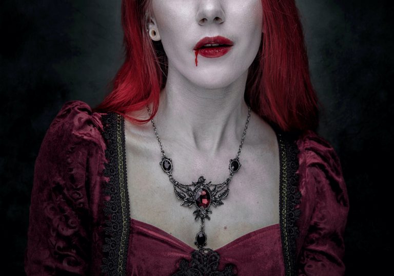 woman with blood dripping from her mouth