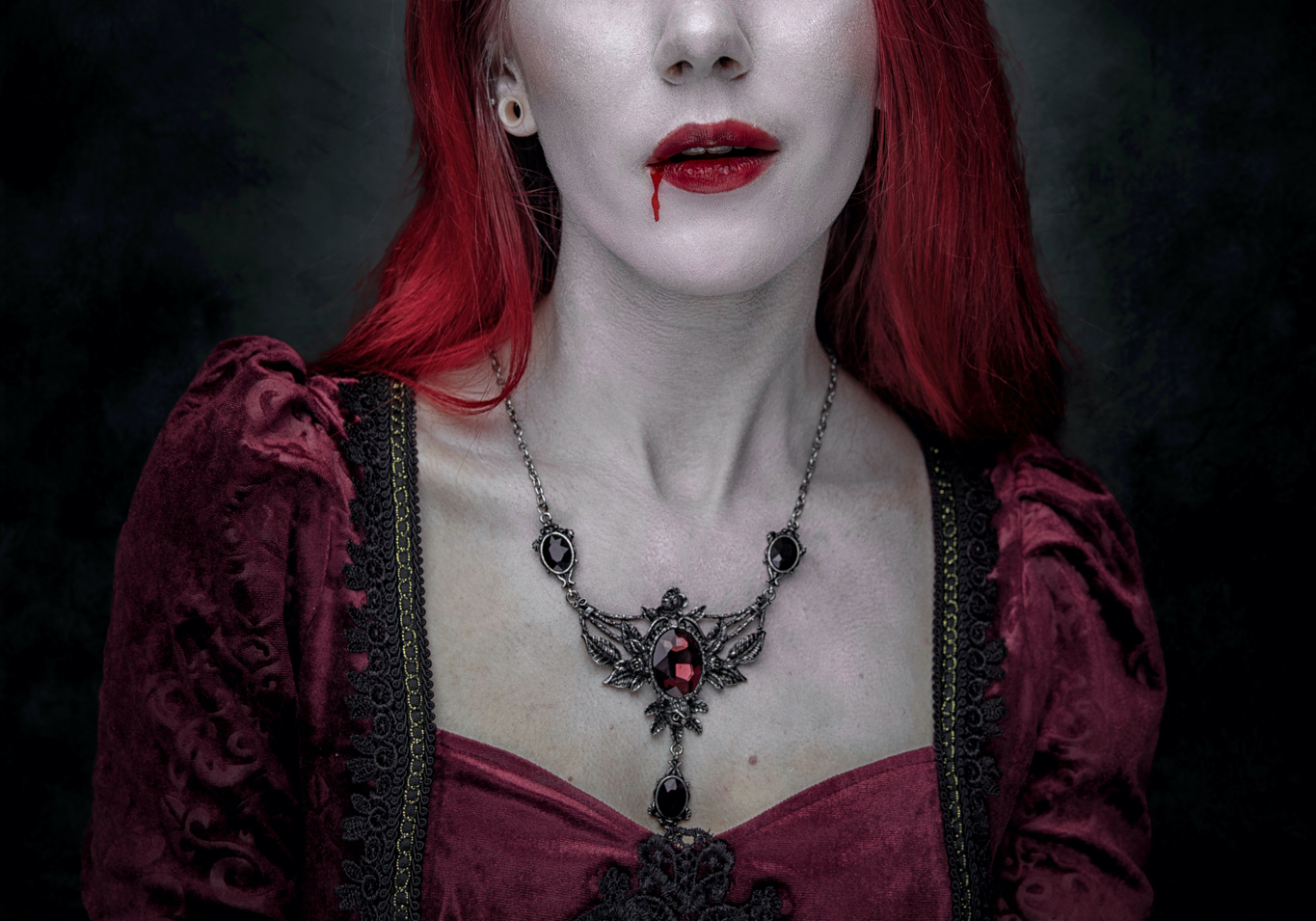 woman with blood dripping from her mouth