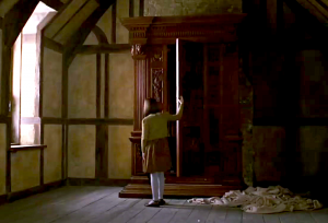 Lucy opening the wardrobe in the 2005 film of "The Lion, the Witch, and the Wardrobe"