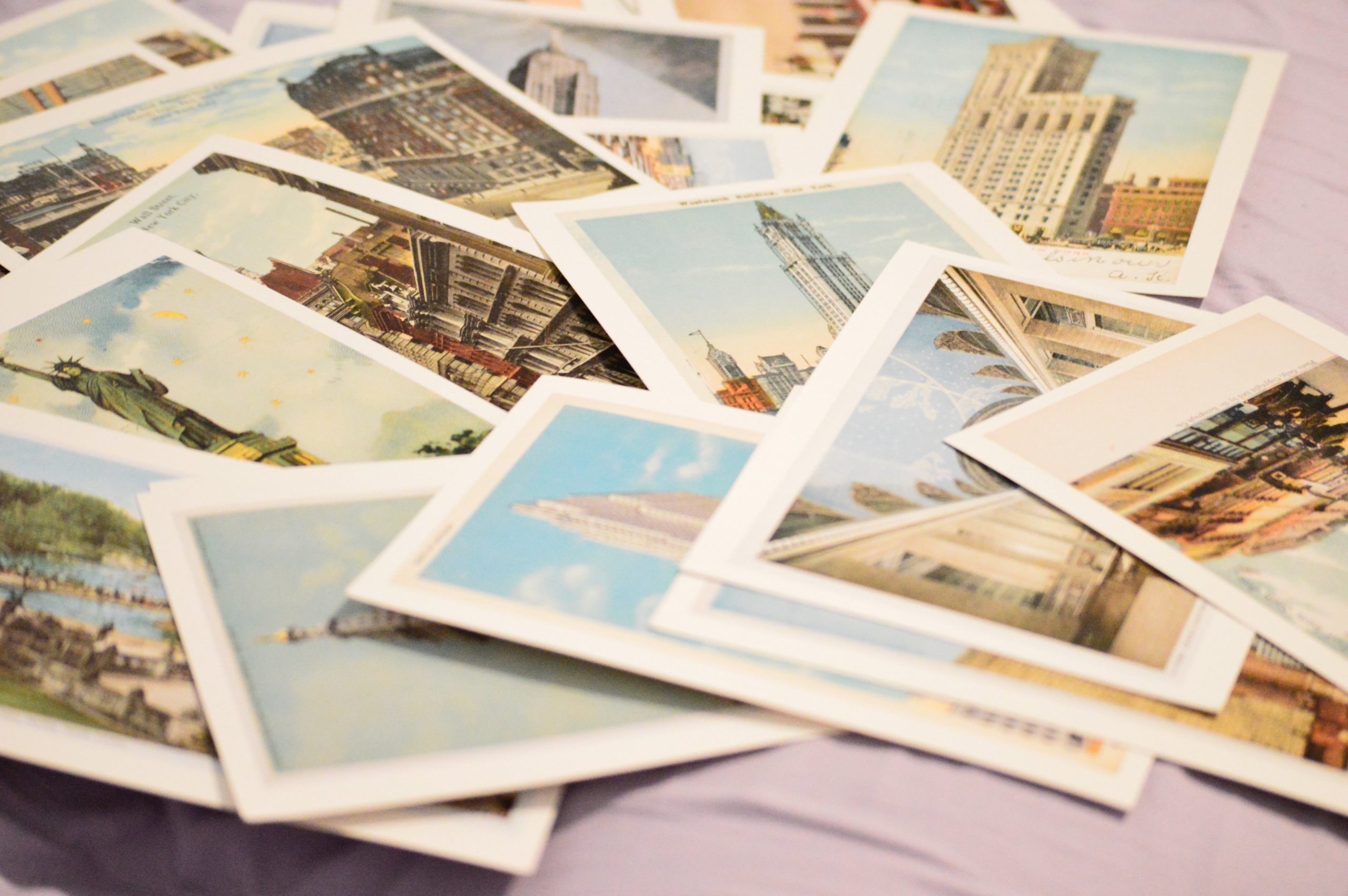 A pile of travel postcards