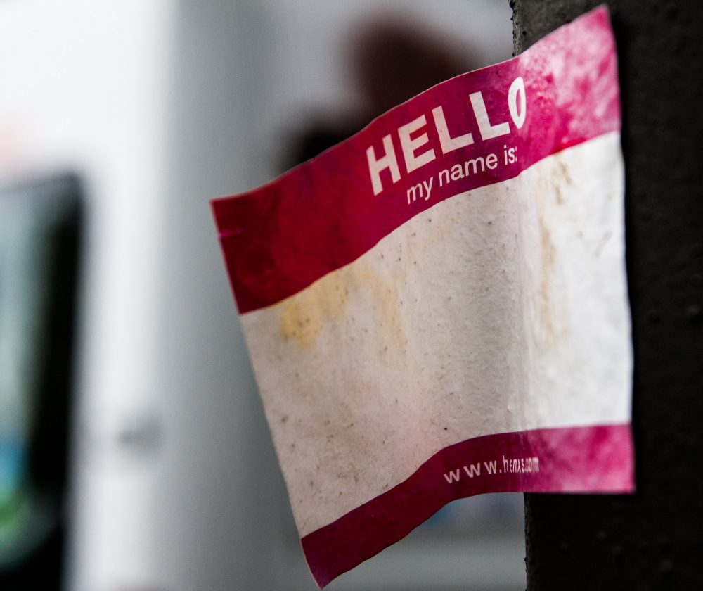 Blank "hello, my name is" sticker stuck to pole