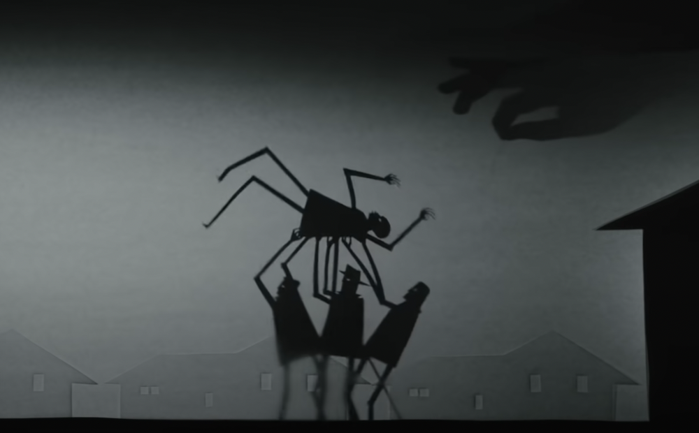 Image of shadow figures holding up another shadow figure