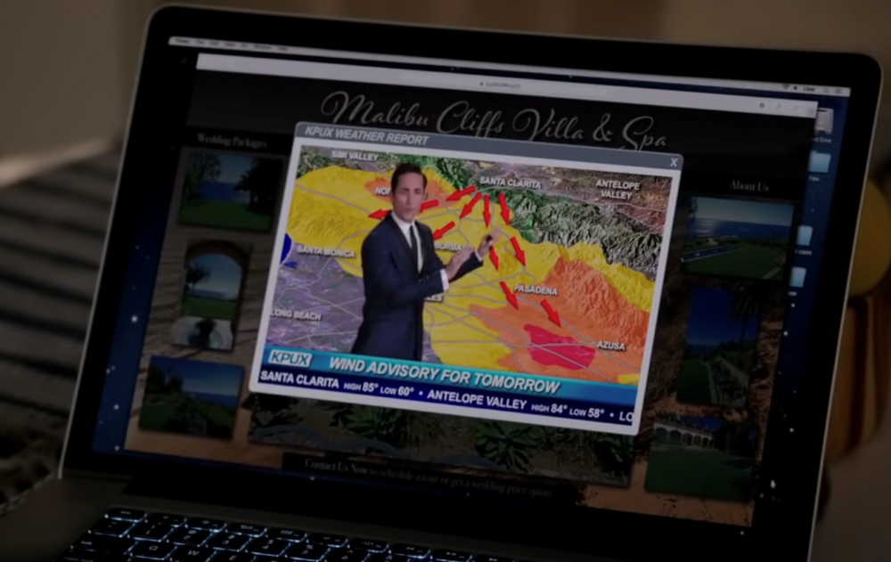 Laptop screen showing wind advisory weather report