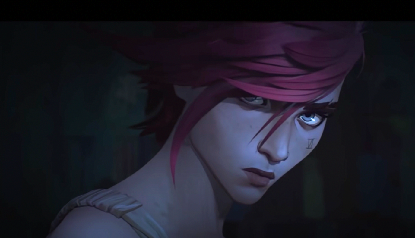 Standing against a dark background, VI looks broodingly toward the camera.