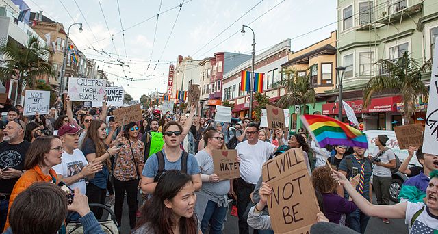 Holding up signs reading "DENOUNCE HATE" "QUEERS BASH BACK" and "NOT MY PRESIDENT," a mass of anti-Trump protestors march through the Castro in San Francisco.