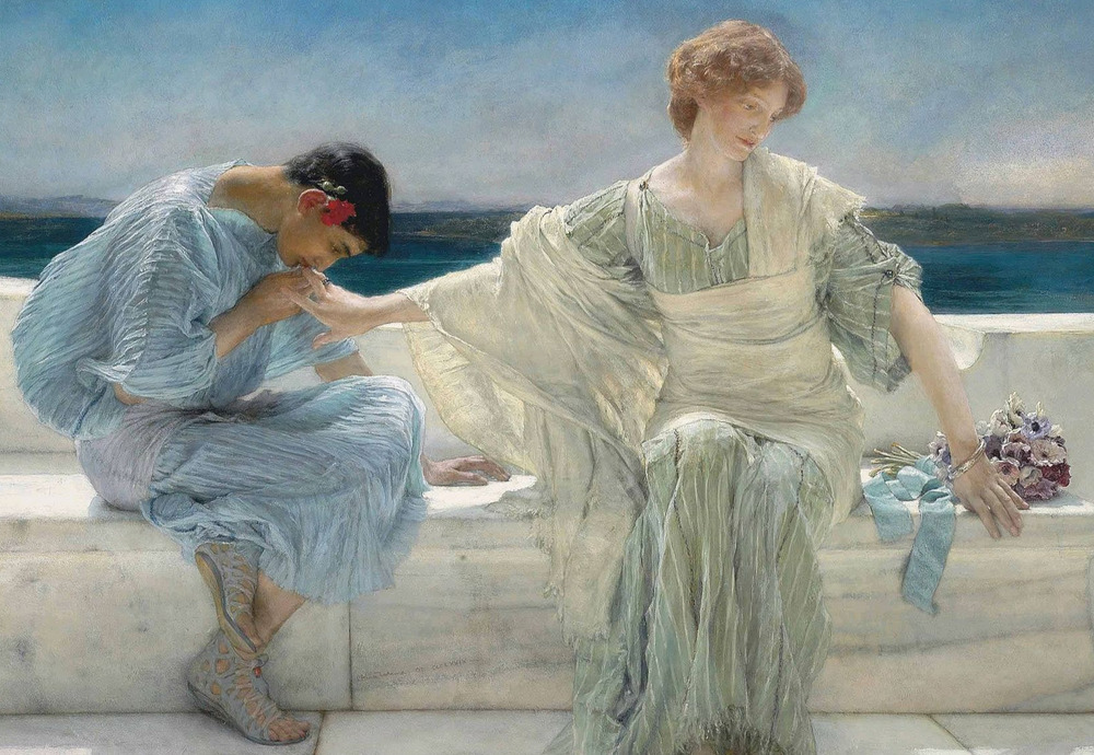 A blonde woman in a blue dress looks away as a brunette woman kisses her hand