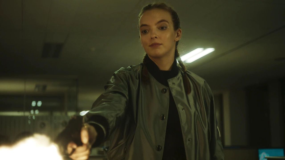 Villanelle from "Killing Eve" holds and shoots a gun