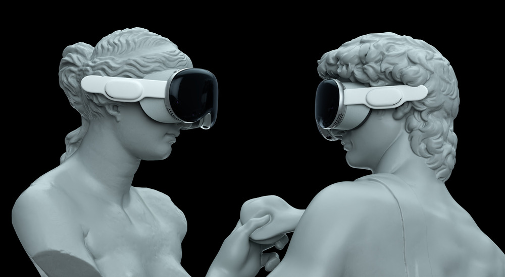 Two Greek statues, one woman and one man, face each other while wearing VR goggles