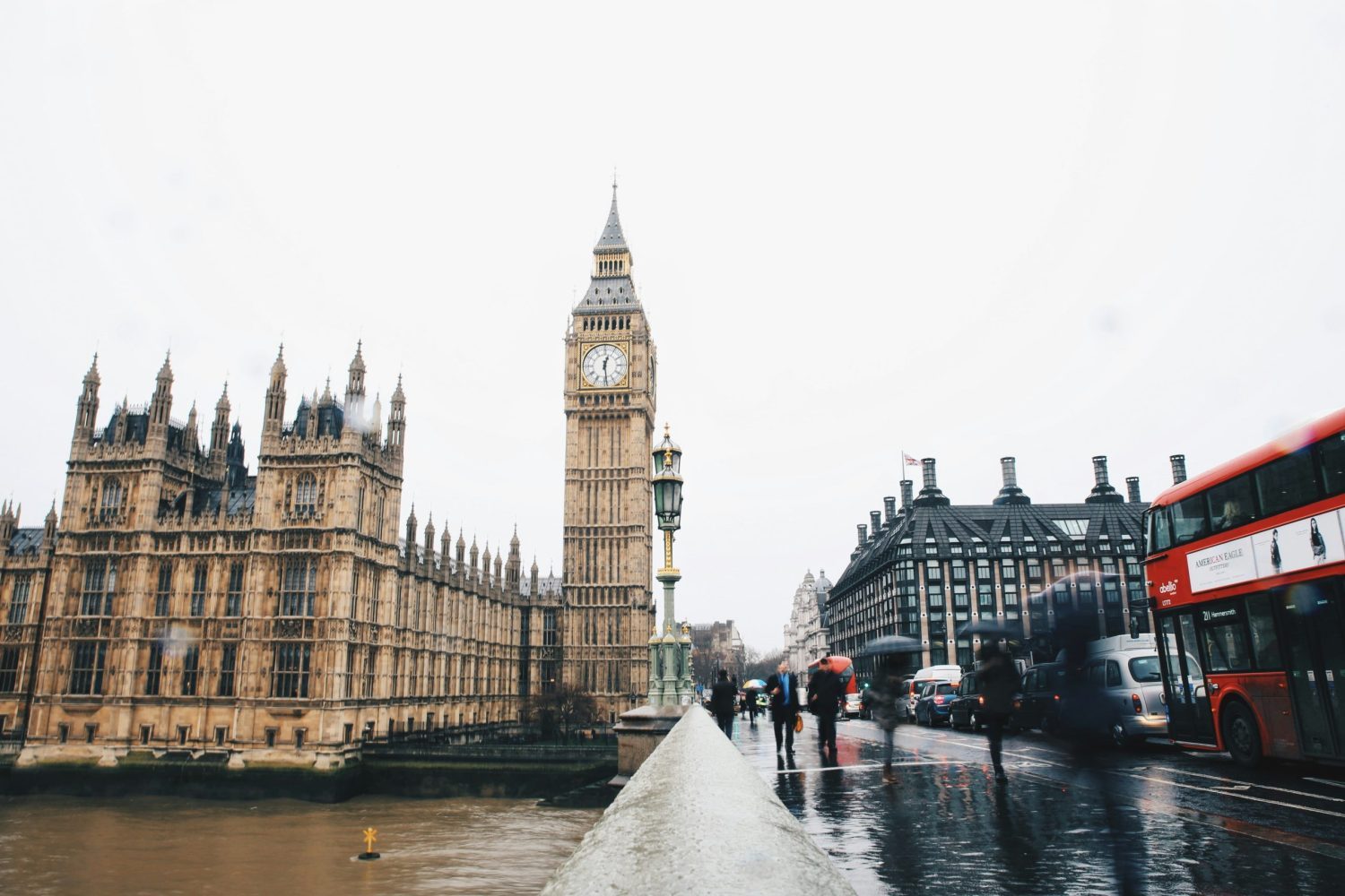 Big Ben clocktower with red bus in the background