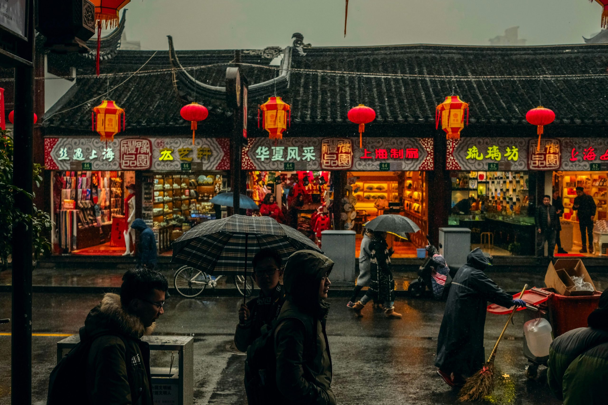 People holding umbrellas in Shanghai, China