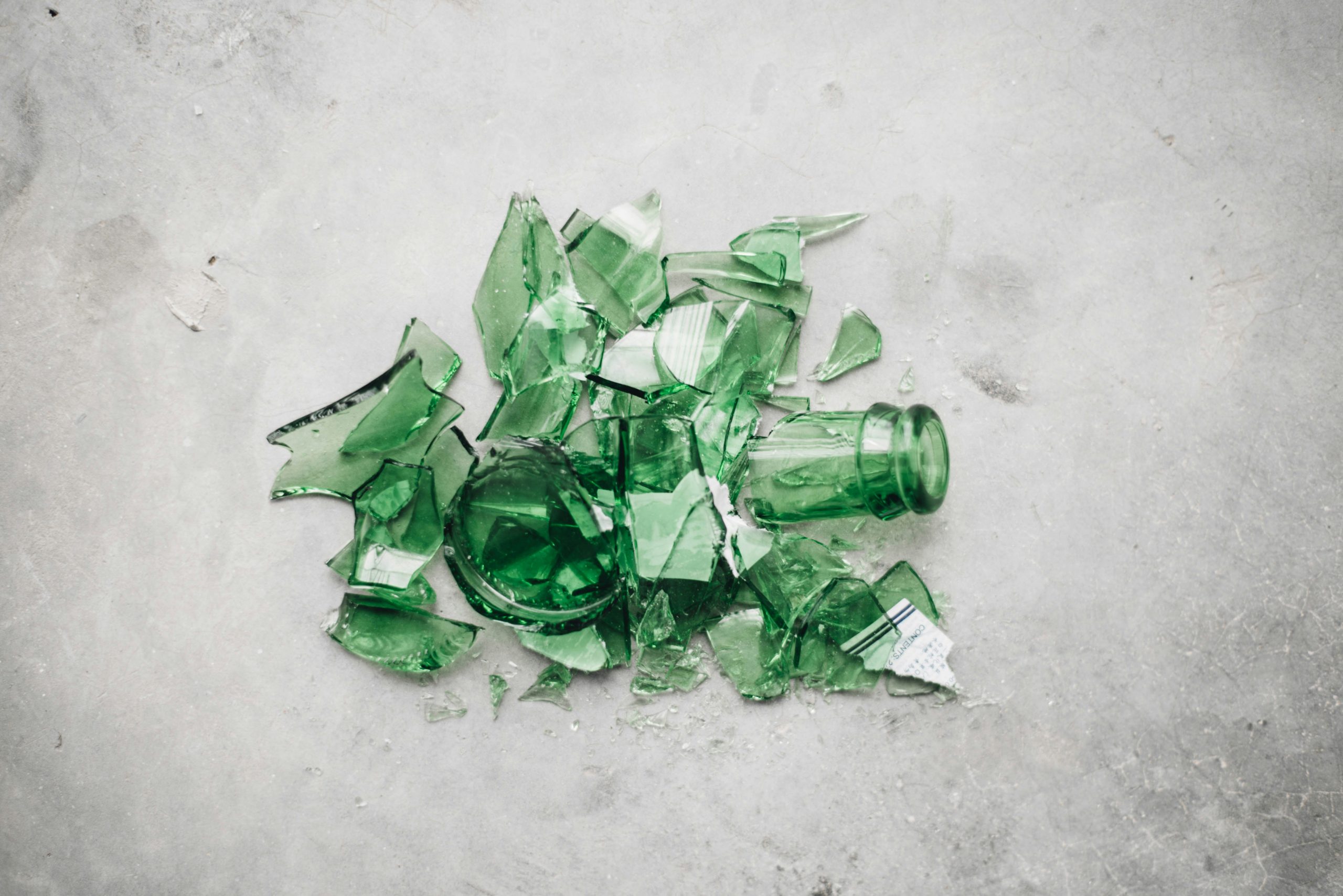 Broken green glass bottle