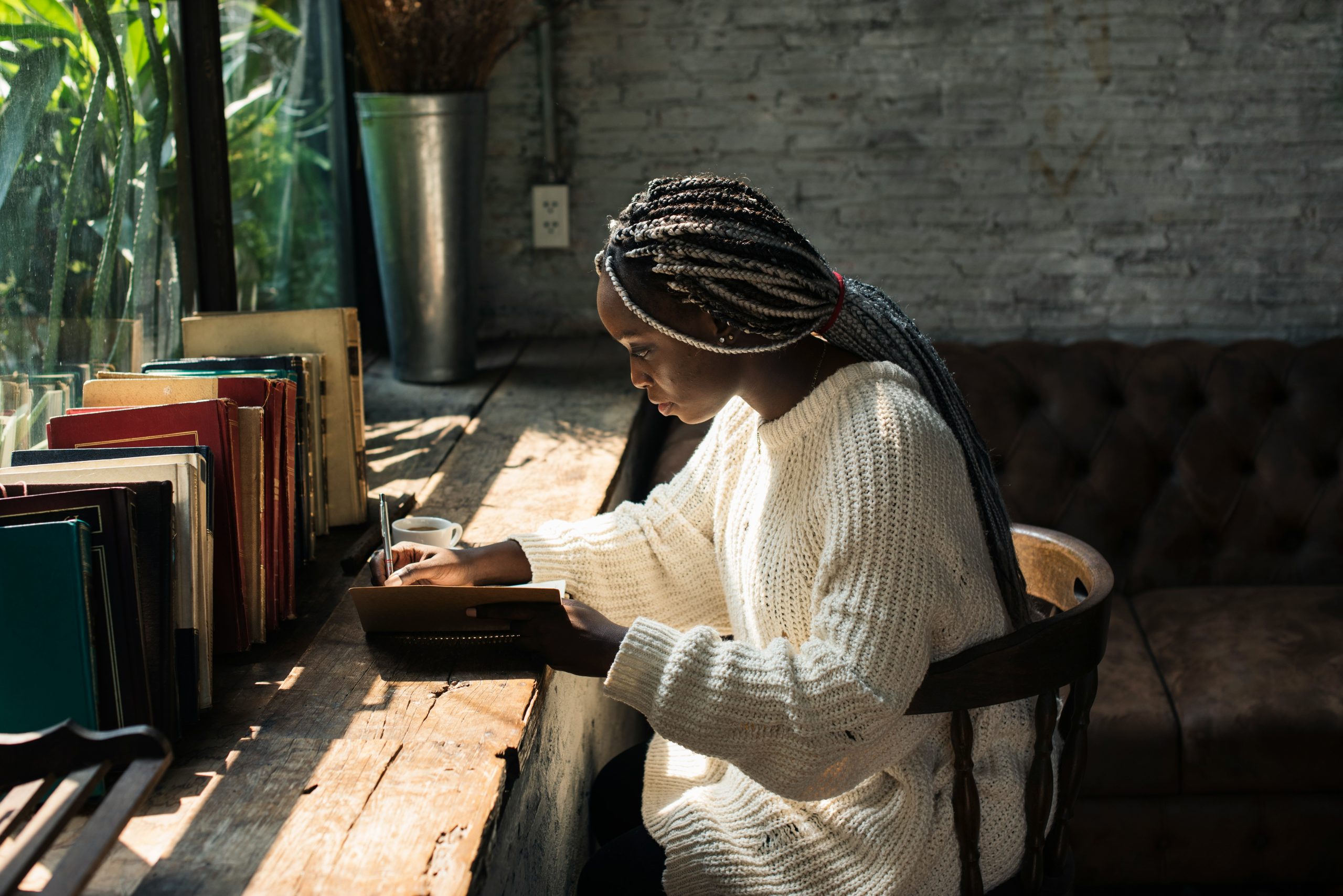 Black woman reading at a counter