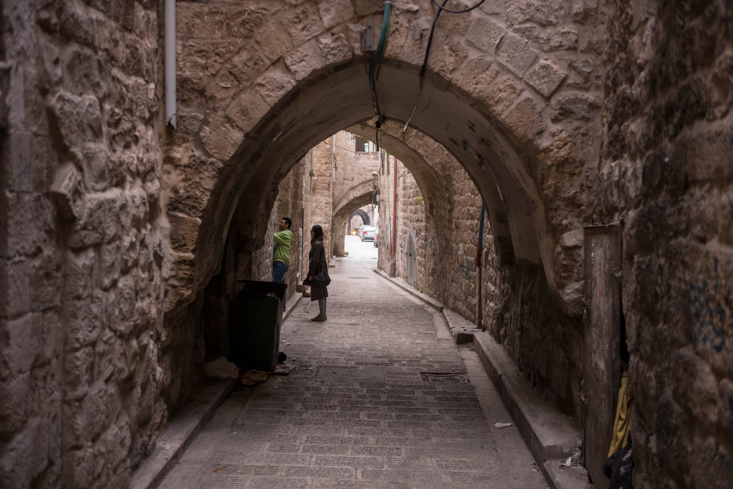 Nablus, Palestine - December 19 2017: The narrow historic street with the Arabic-style arch in old town Nablus.