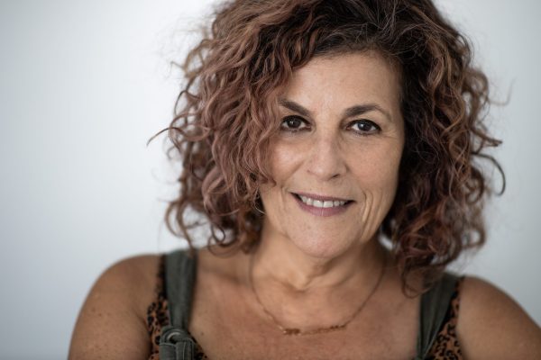 The author, Michelle Herman, in chin-length hair, smiling straight into the camera